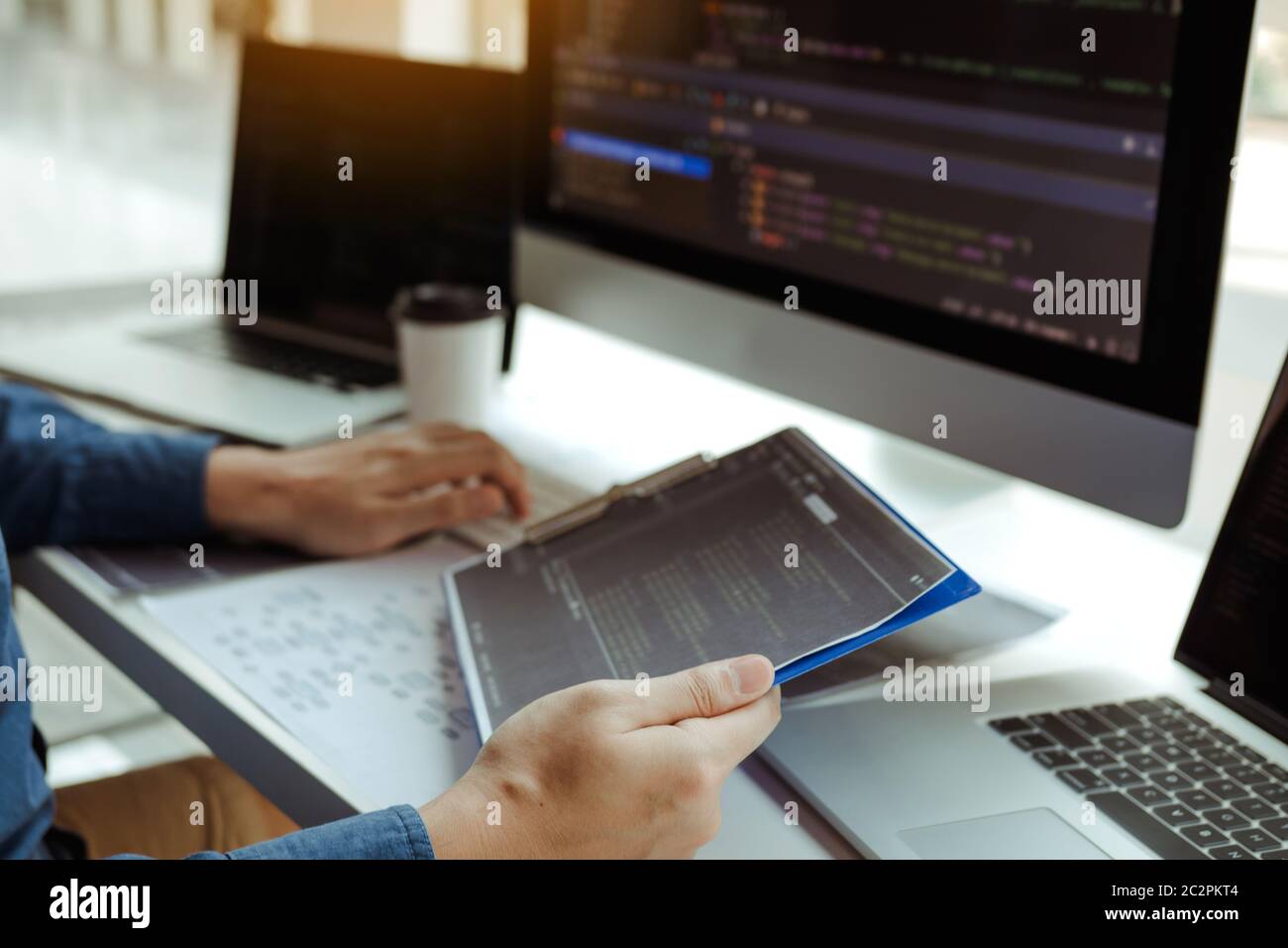 Asian man working code program developer computer web development working design software on desk in office. Stock Photo