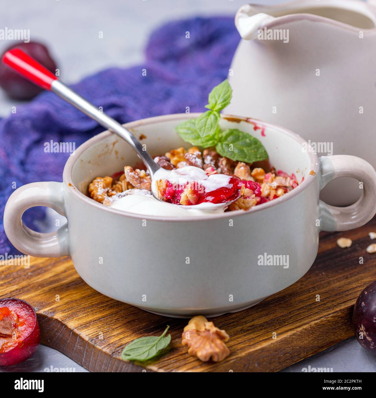 Red cherry plum crumble for healthy breakfast Stock Photo Alamy