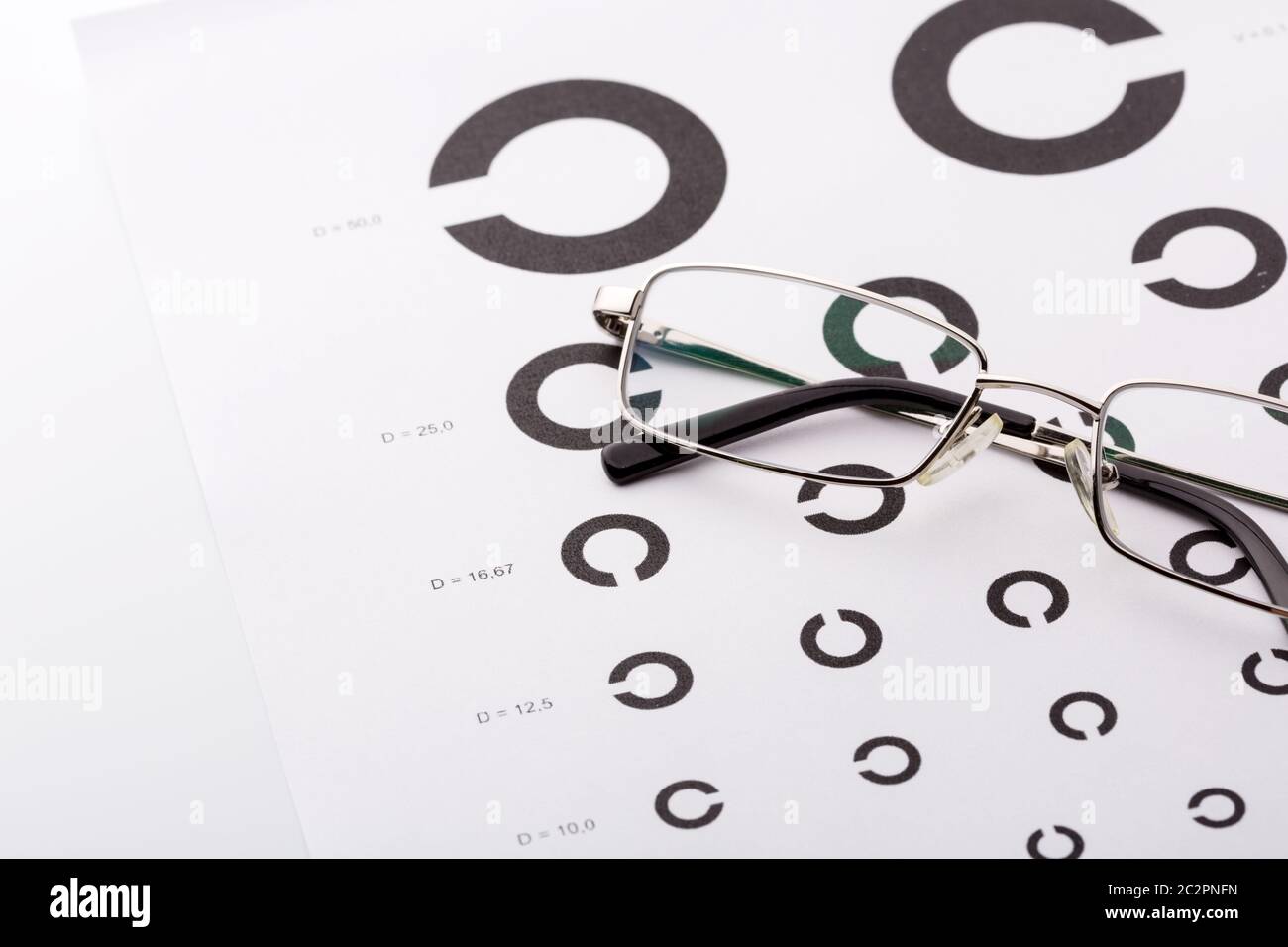 Eye examination chart with glasses on it Stock Photo