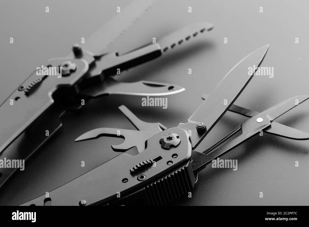 Black opened multitool knife closeup Stock Photo Alamy