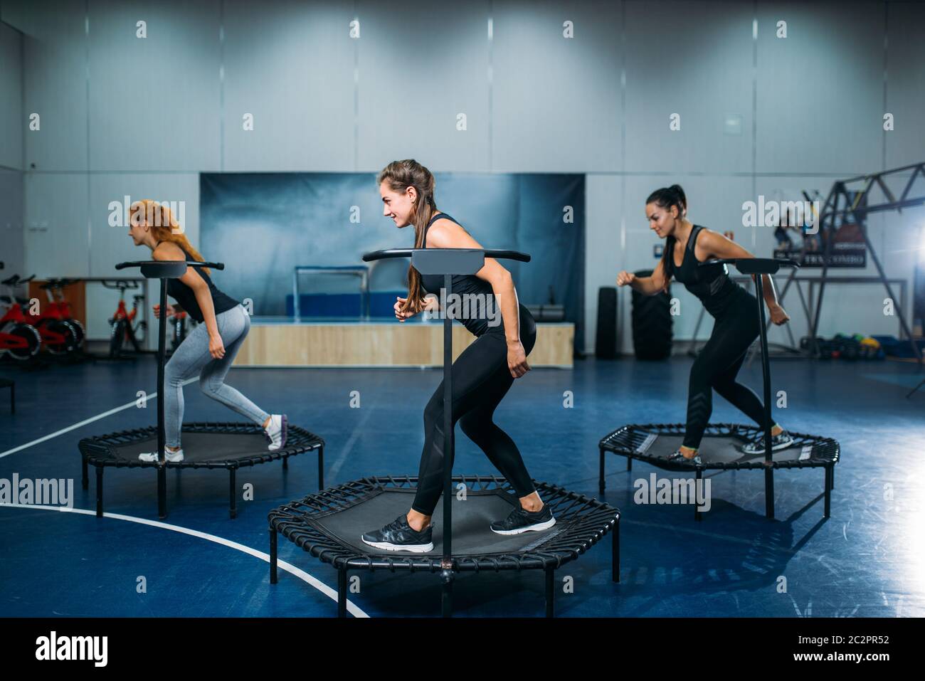 Women group on sport trampoline, fitness workout. Female teamwork in gym.  Aerobic class Stock Photo - Alamy