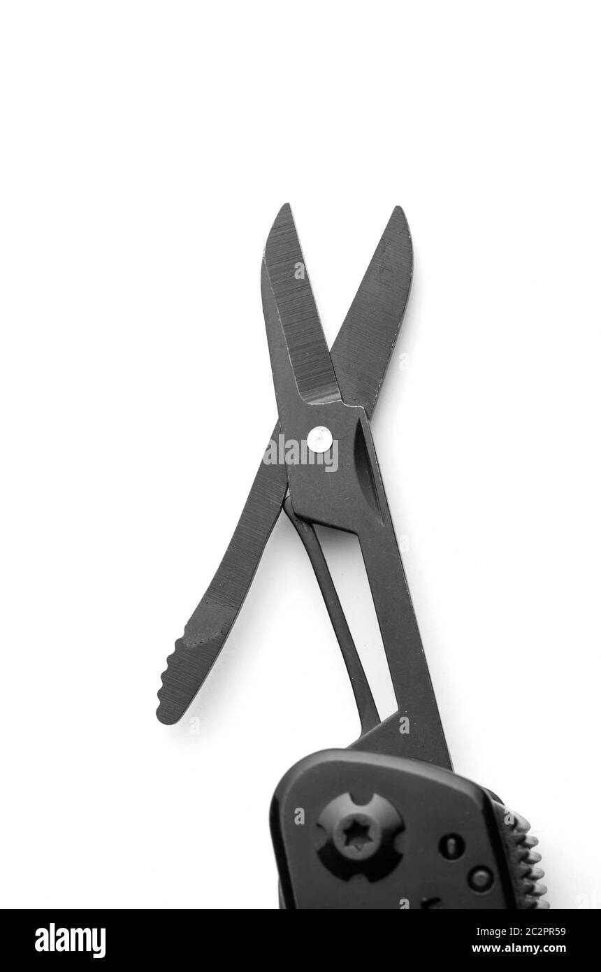 Black opened scissors on multitool knife isolated on white Stock Photo