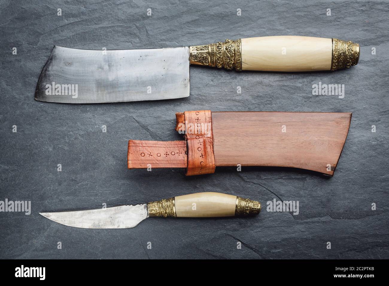 Traditional handmade balinese knife belakas shot on a slate background. Bali, Indonesia Stock