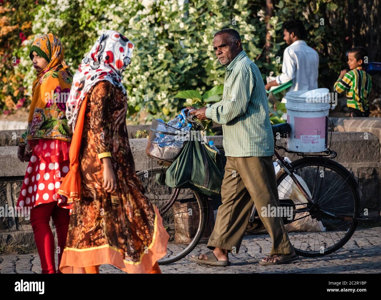 Indian man walking side view hi-res stock photography and images - Alamy