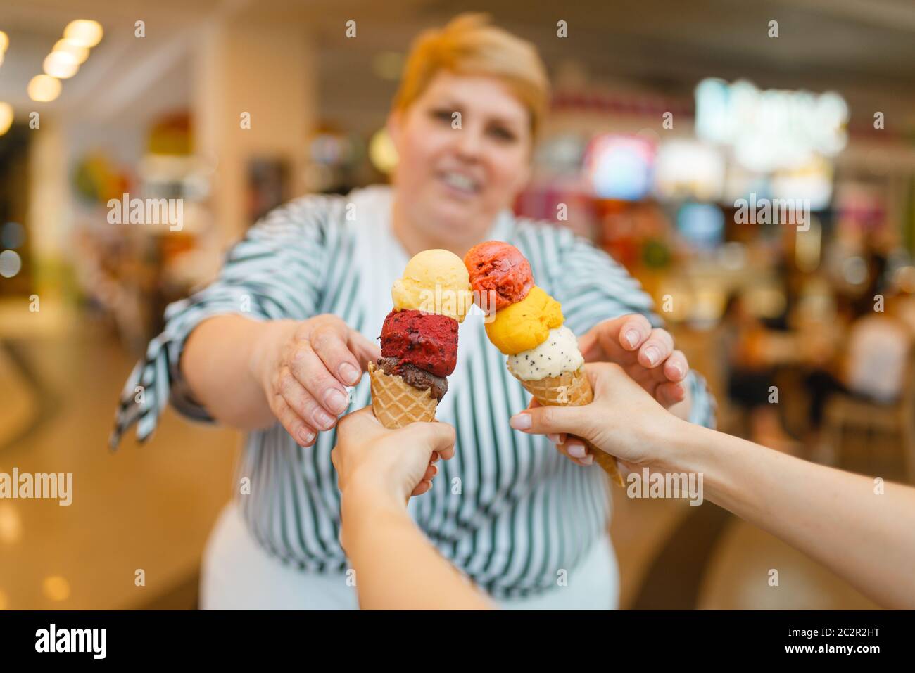 Woman eating ice cream fat hires stock photography and images Alamy