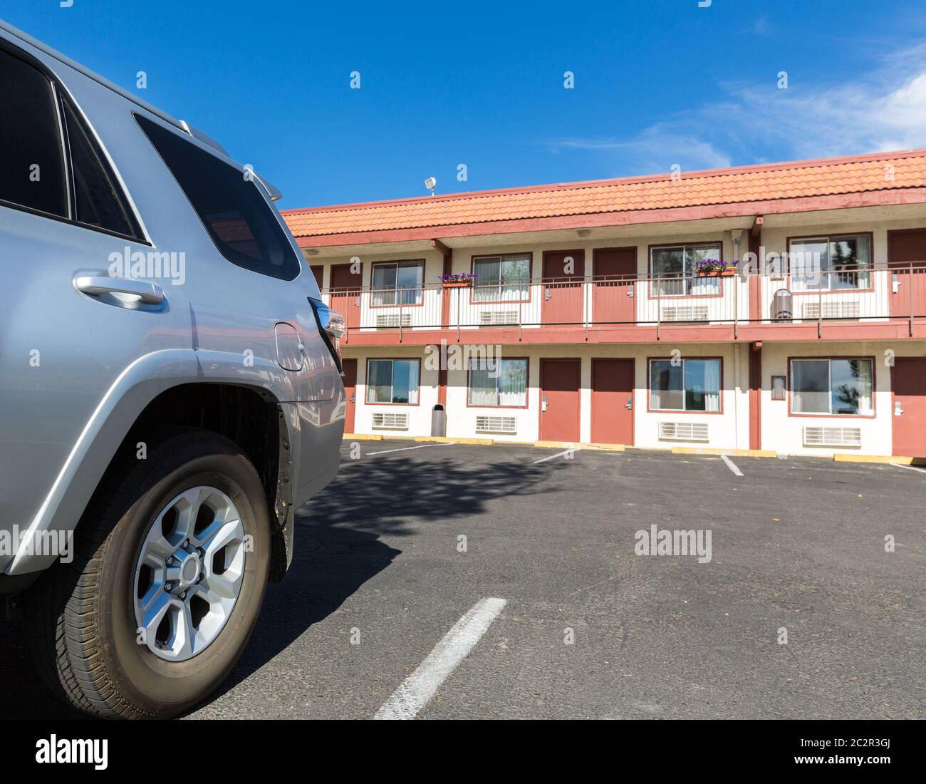 Typical american inexpensive road motel with parking and separate rooms ...