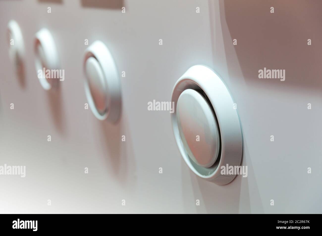 Showcase with plastic covers for air vents closeup. Forced ventilation for bathroom, kitchen or house rooms Stock Photo