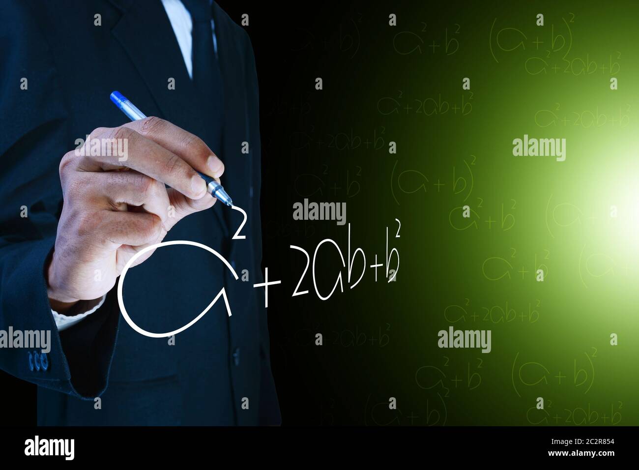 Man writing the mathematical equations Stock Photo