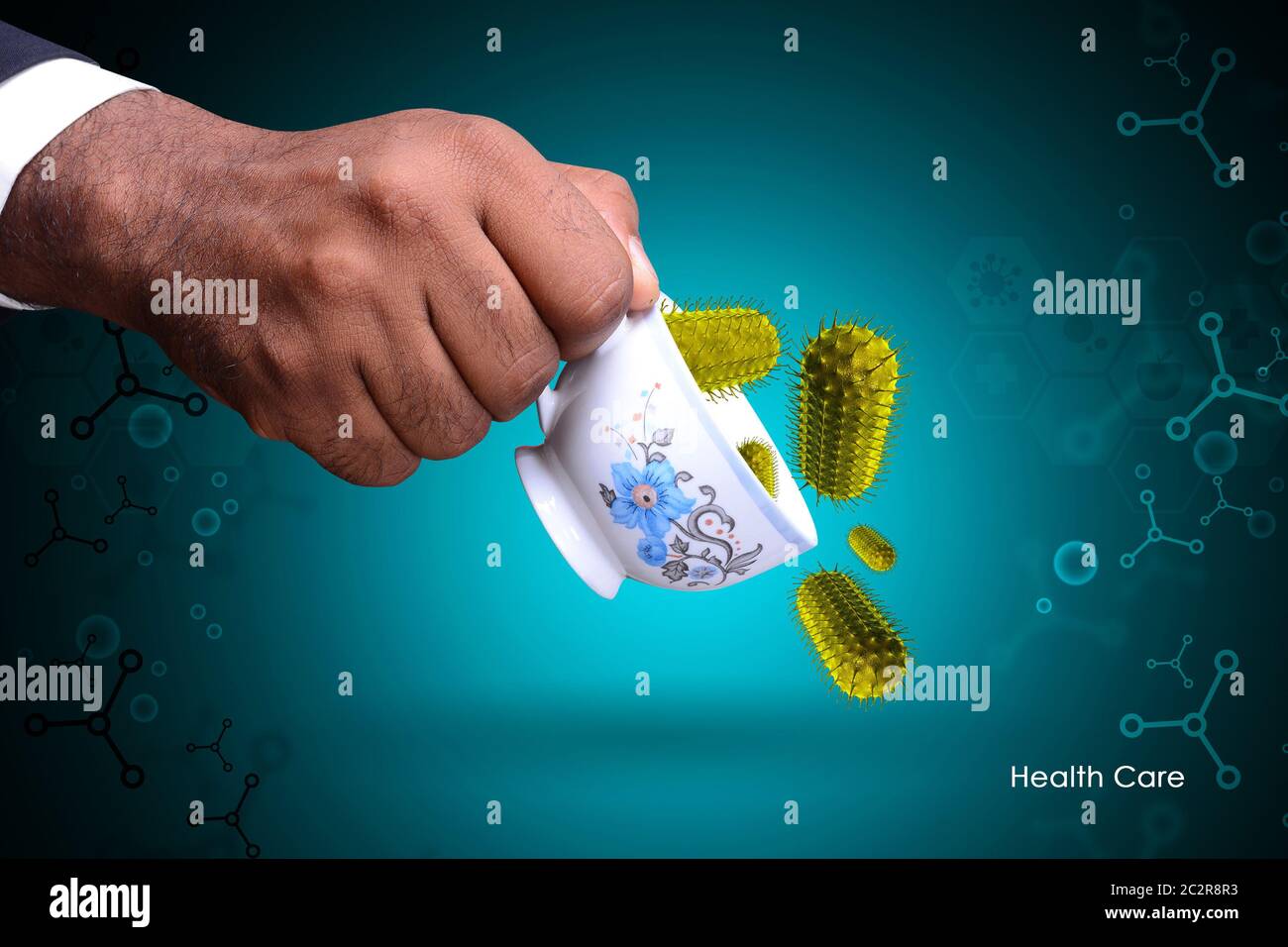 Virus Tea smart hand showing virus in tea cup Stock Photo - Alamy