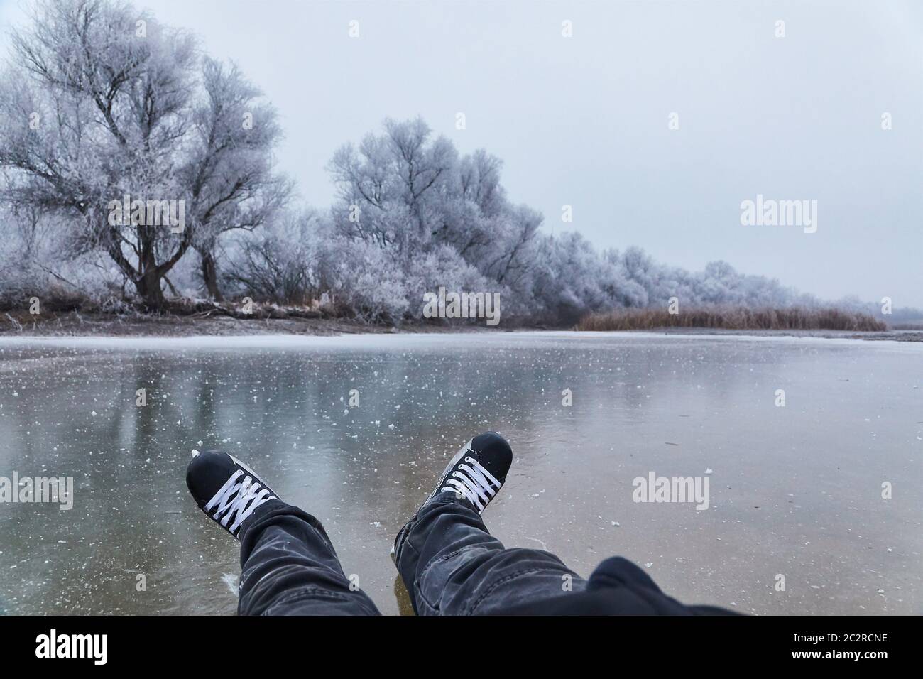Ice skating on frozen lake Stock Photo - Alamy