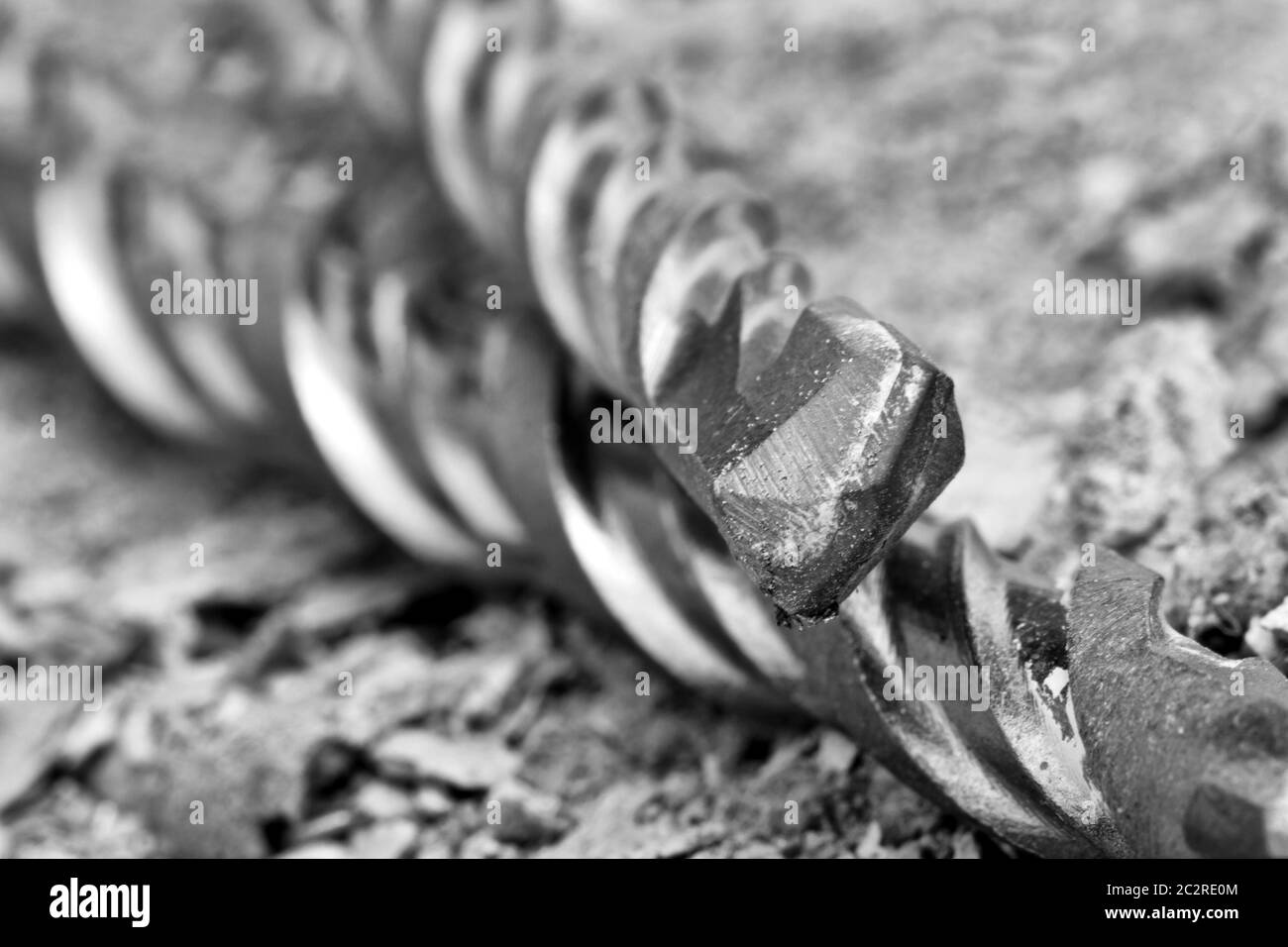 Industrial drills on cracked concrete. Close-up view Stock Photo
