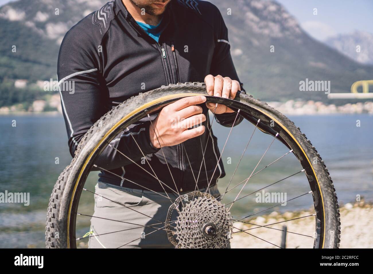 Bike Repair. Man Repairing Mountain Bike. Cyclist man in trouble rear