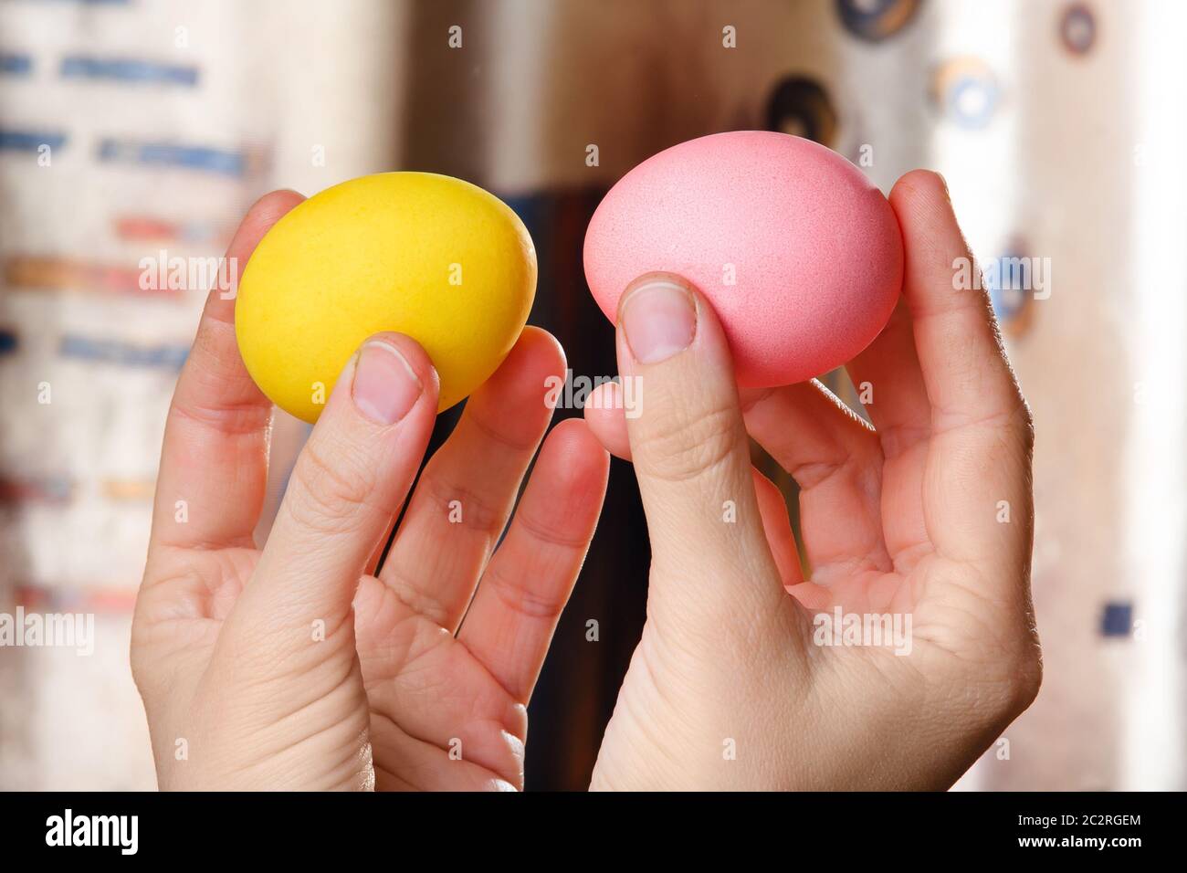 Hands holding easter eggs ready for battle Stock Photo