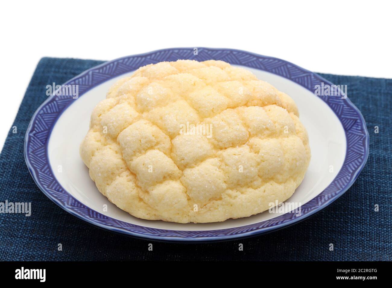 Japanese meronpan bread on dish on table Stock Photo