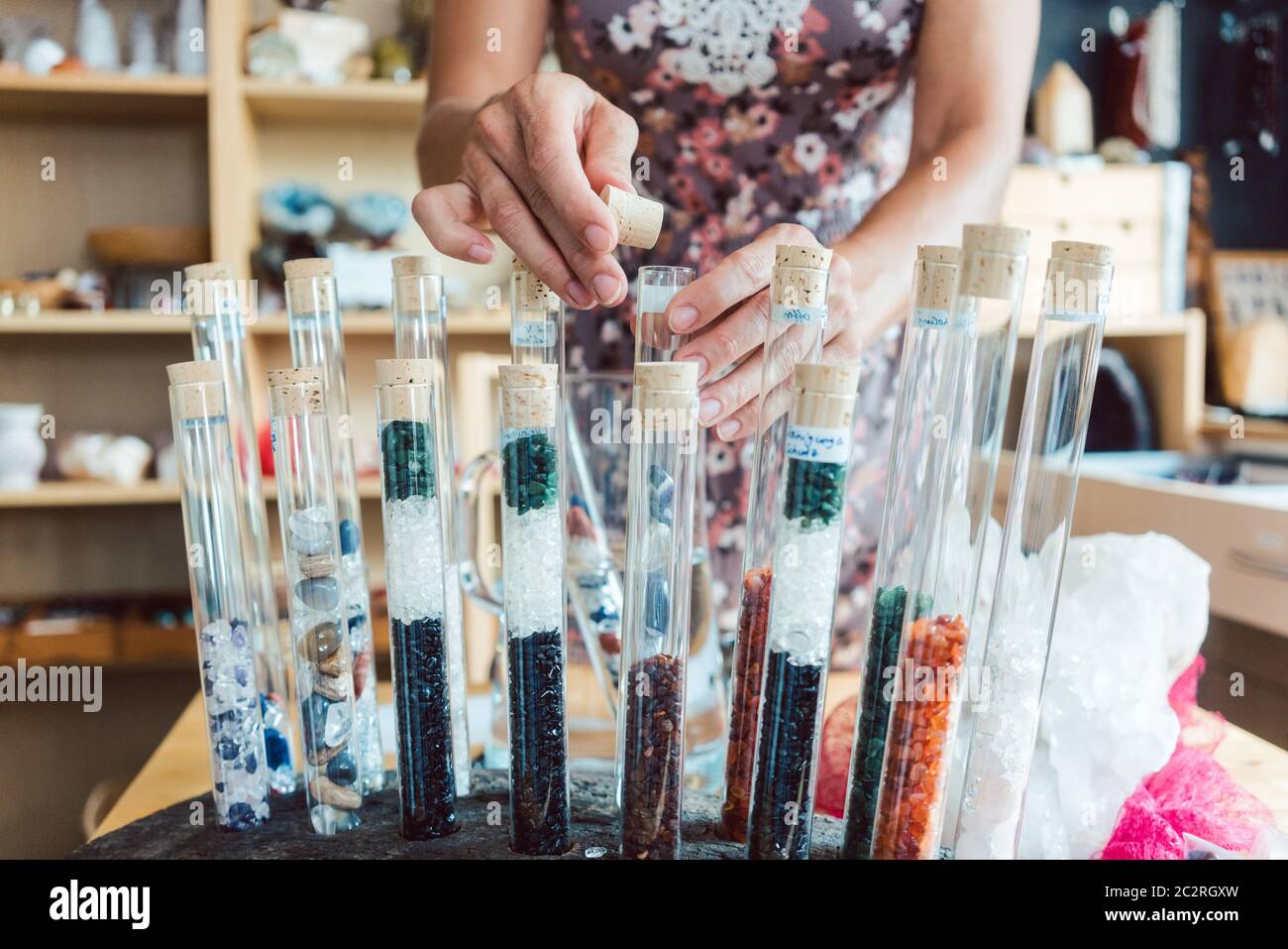 Woman having gemstones as a hobby showing them to the camera Stock