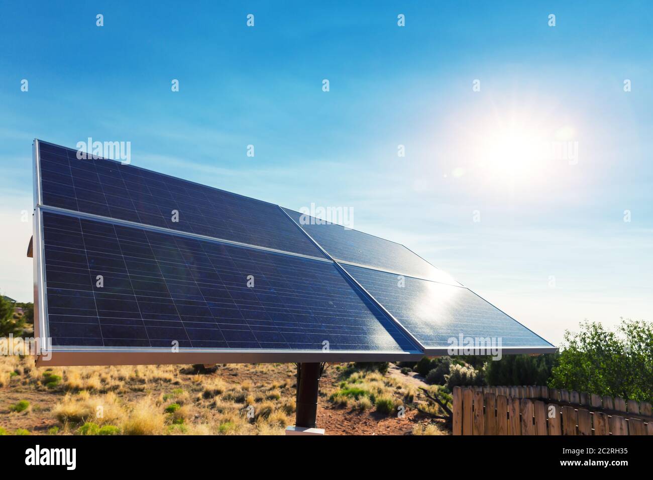 Blue solar panels against deep blue sky. Alternative energy technology ...