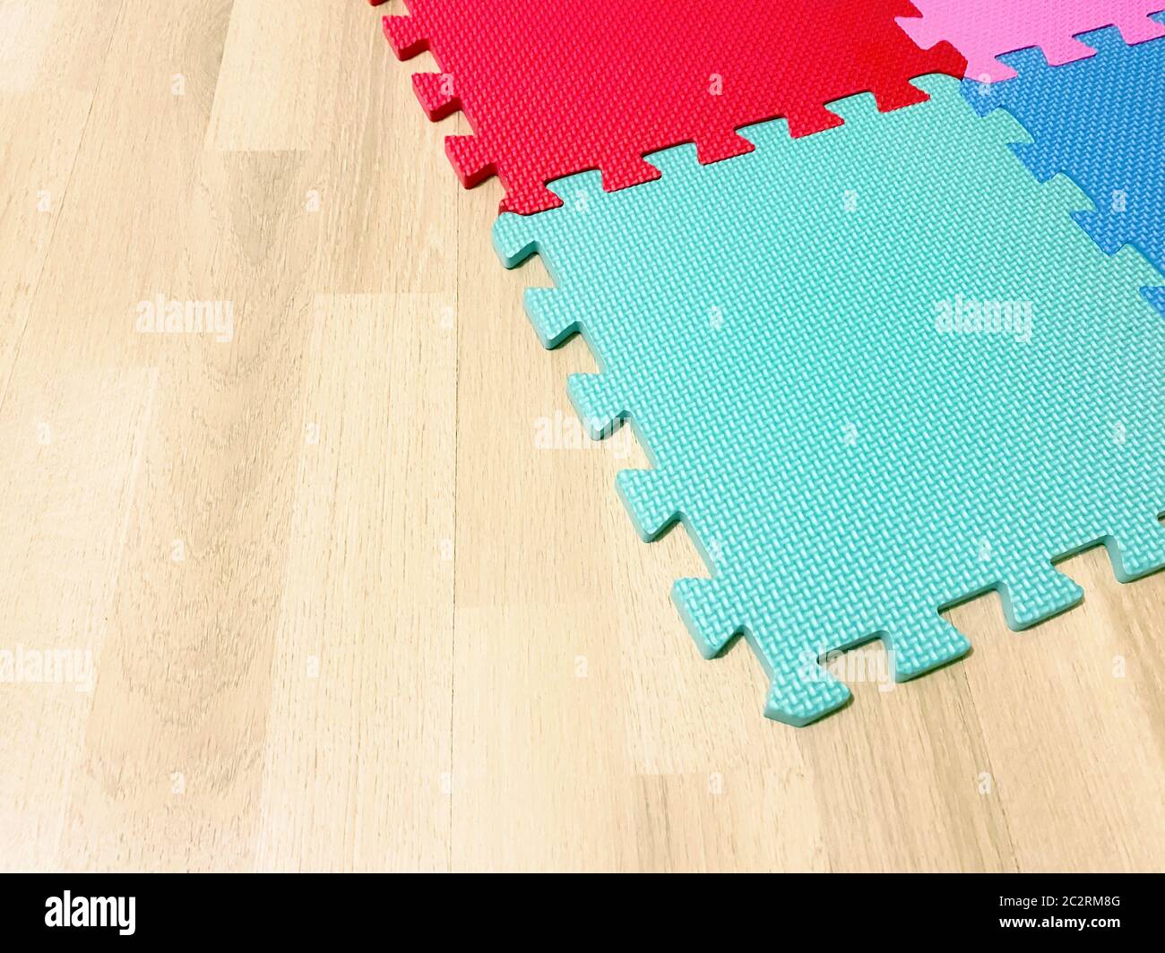 Soft rubber mat composed of colored blocks intersected with each other