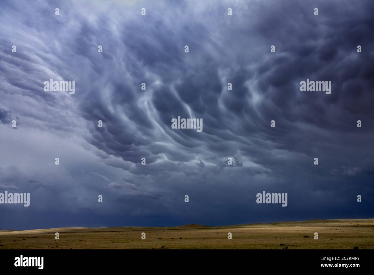Mammatus clouds sky over steppe Stock Photo