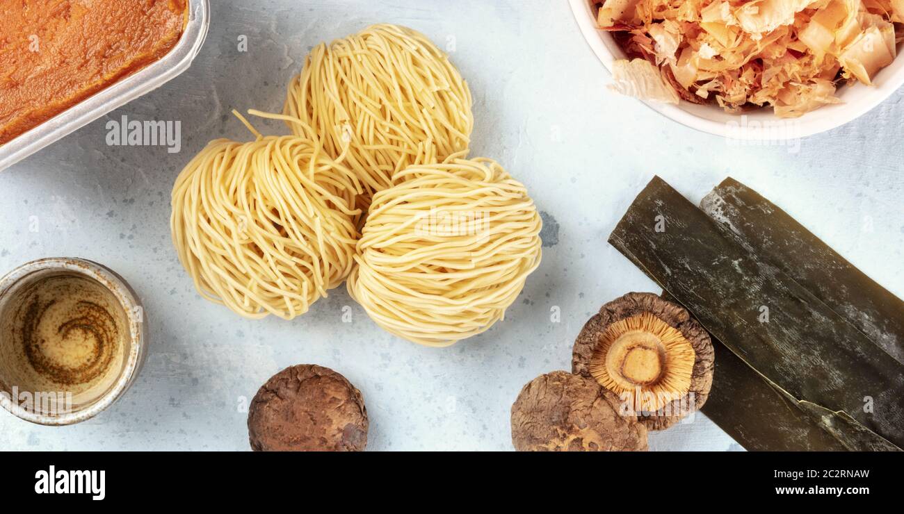 Ramen ingredients panorama. Dried sea vegetable kelp, soba noodles, dashi, tuna flakes, shiitake