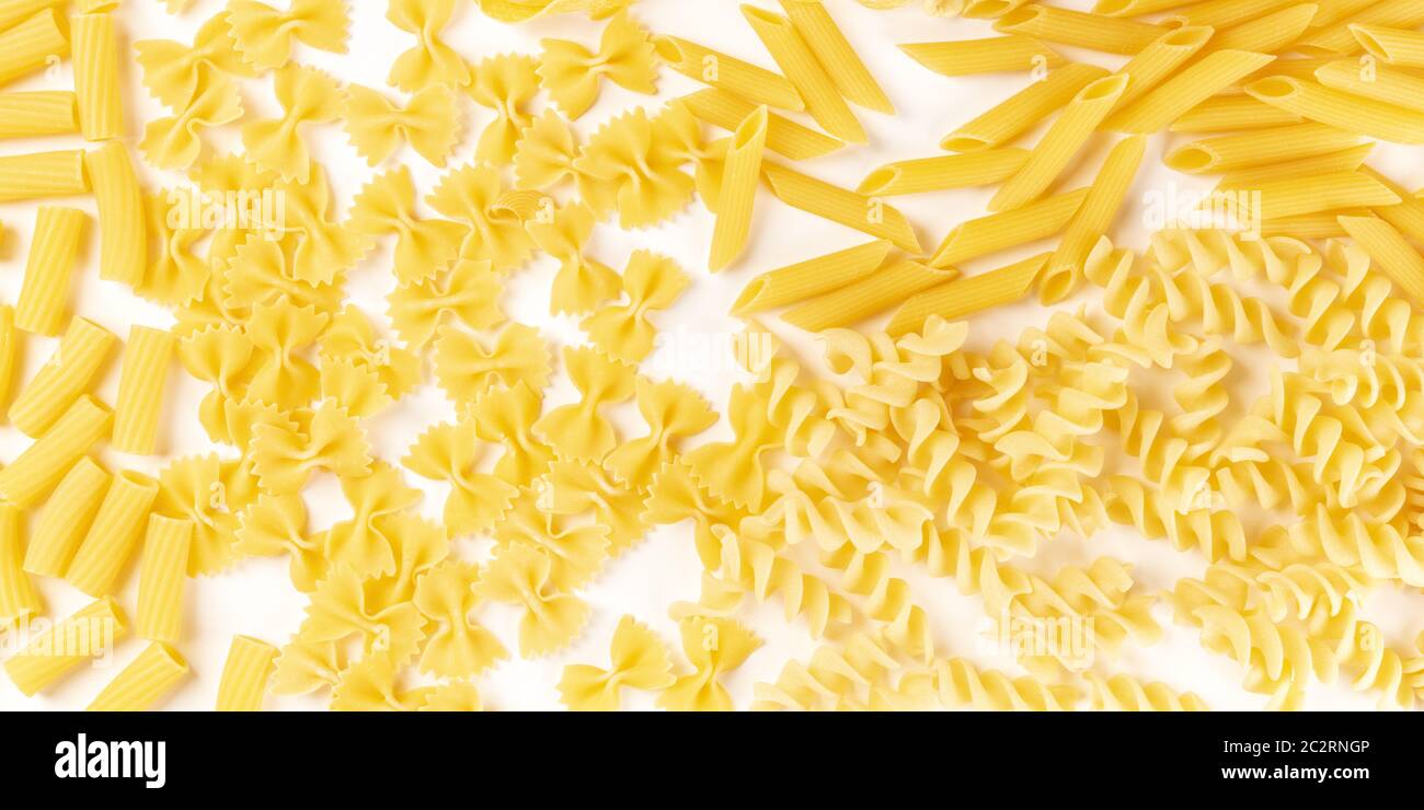 Italian pasta texture panorama, a flat lay banner, top shot on a white