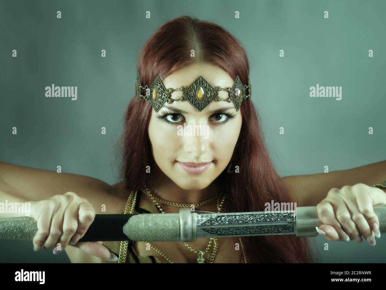 warrior woman holding sword in her hand Stock Photo