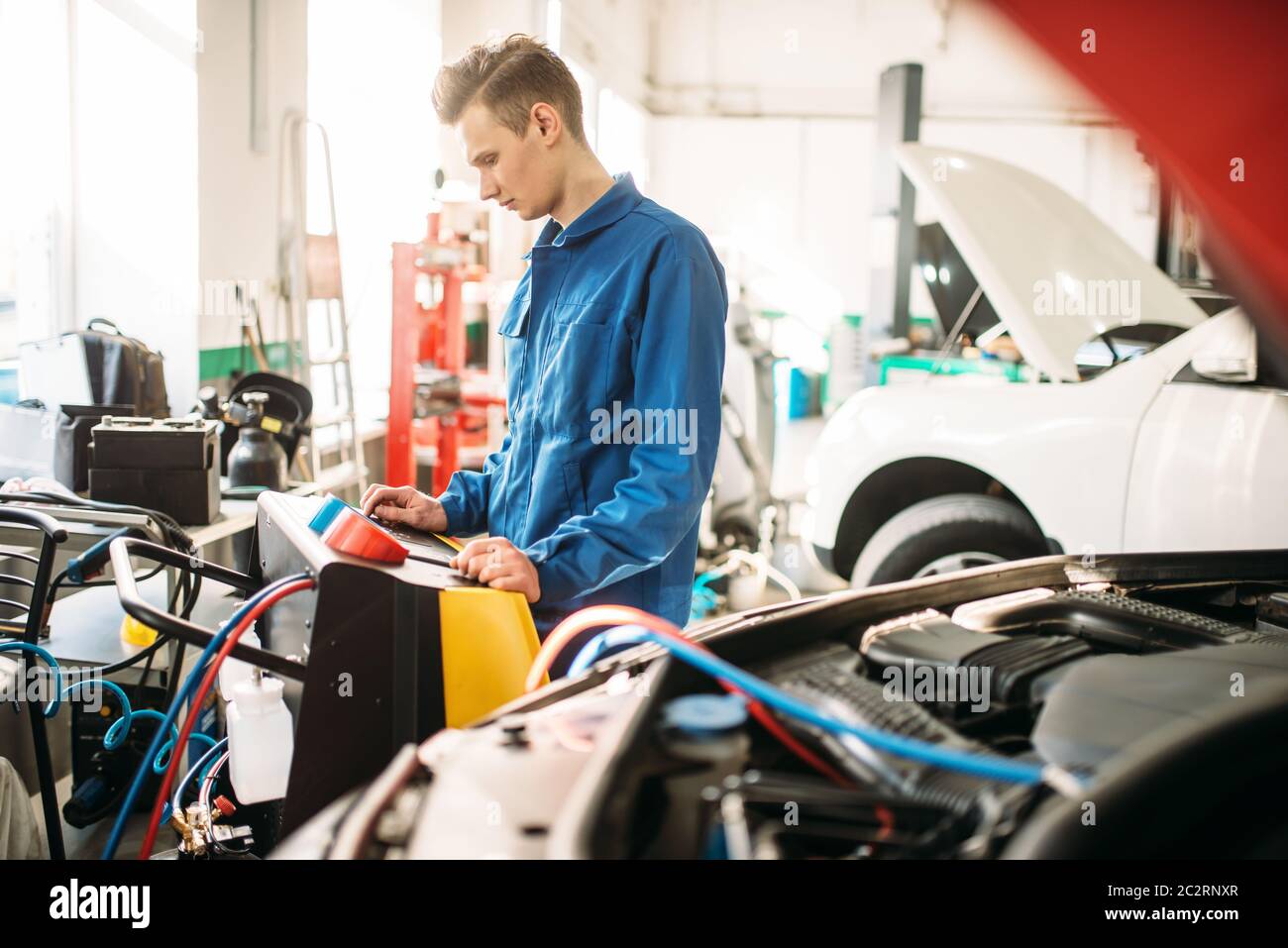 Mechanic checks air conditioning system in car. Conditioner inspection, diagnostic Stock Photo