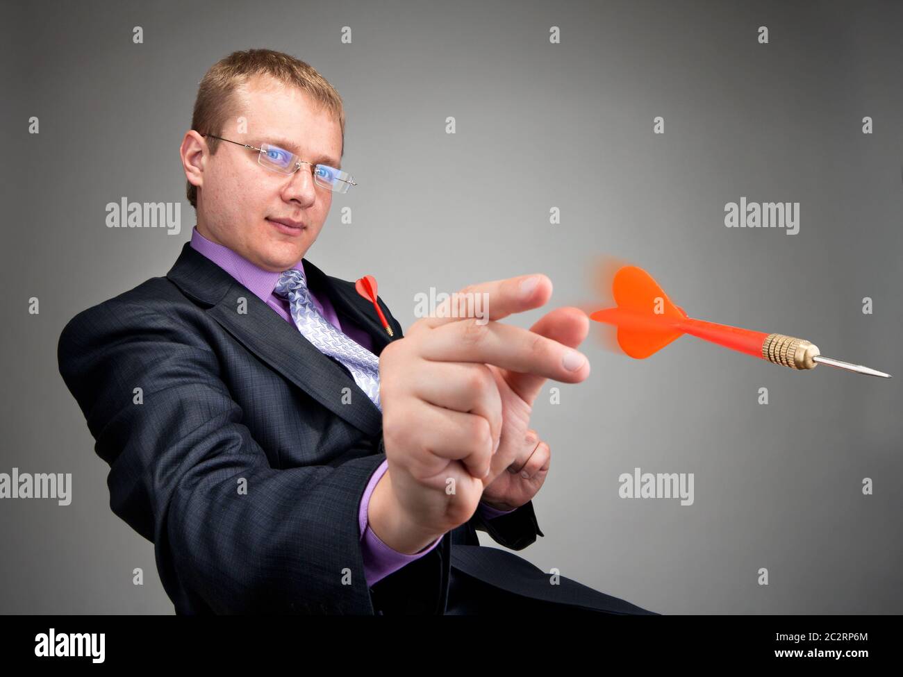 Premium Photo  Male businessman hits the target with darts. dice  aspiration concept with cubs