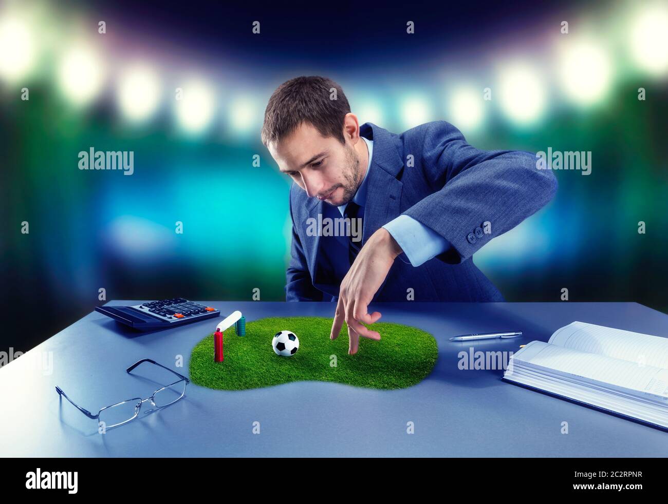 Businessman is playing football with fingers on the desk Stock Photo