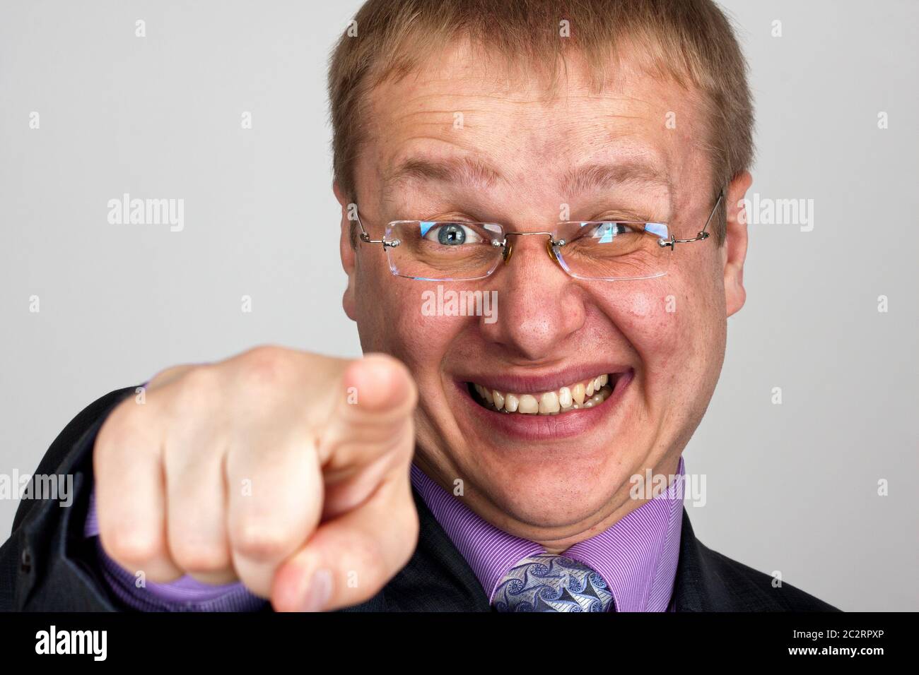Portrait of funny laughing businessman pointing to you Stock Photo Alamy