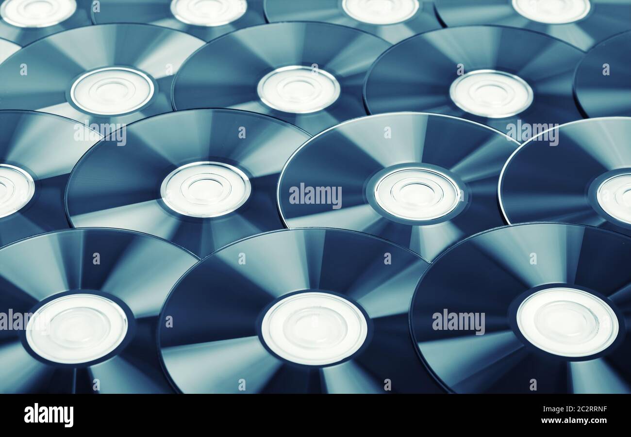 Closeup background of computer disks. Toned image Stock Photo