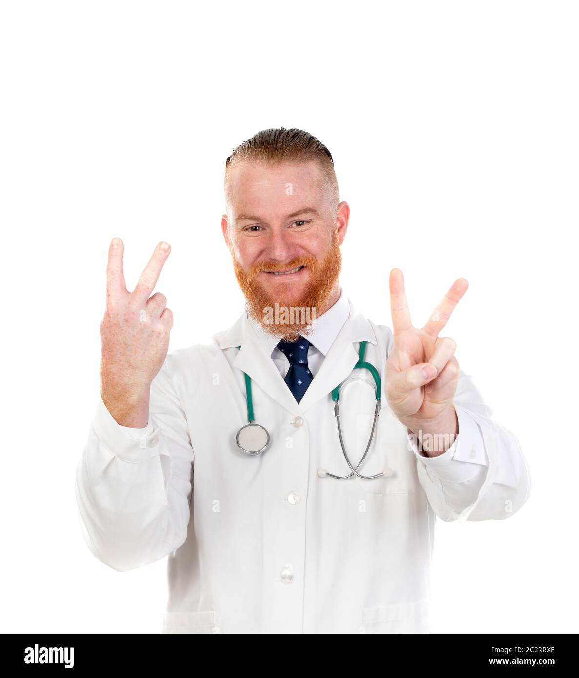 Winner redhead doctor doing victory sign isolated on a white background