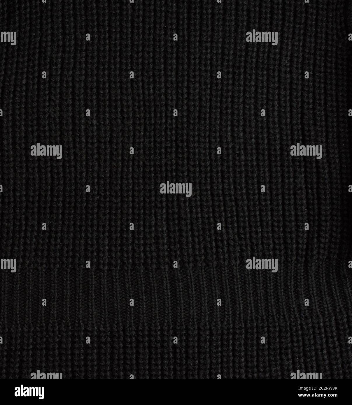 black knitted fabric, full frame, close up Stock Photo
