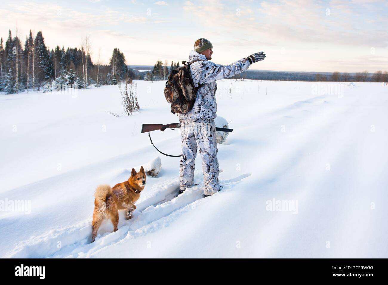hunter on the skis on winter hunting Stock Photo