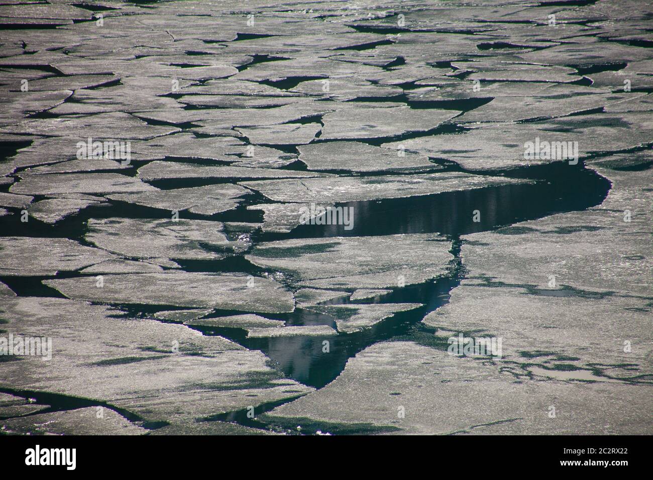 Partially frozen water surface of upper lake in Kananaskis country, Alberta, Canada Stock Photo