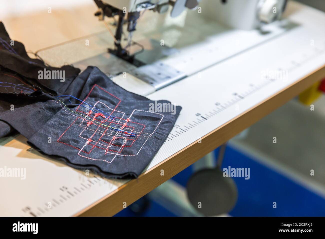 Sewing machine in cutting shop closeup, nobody, clothing factory ...