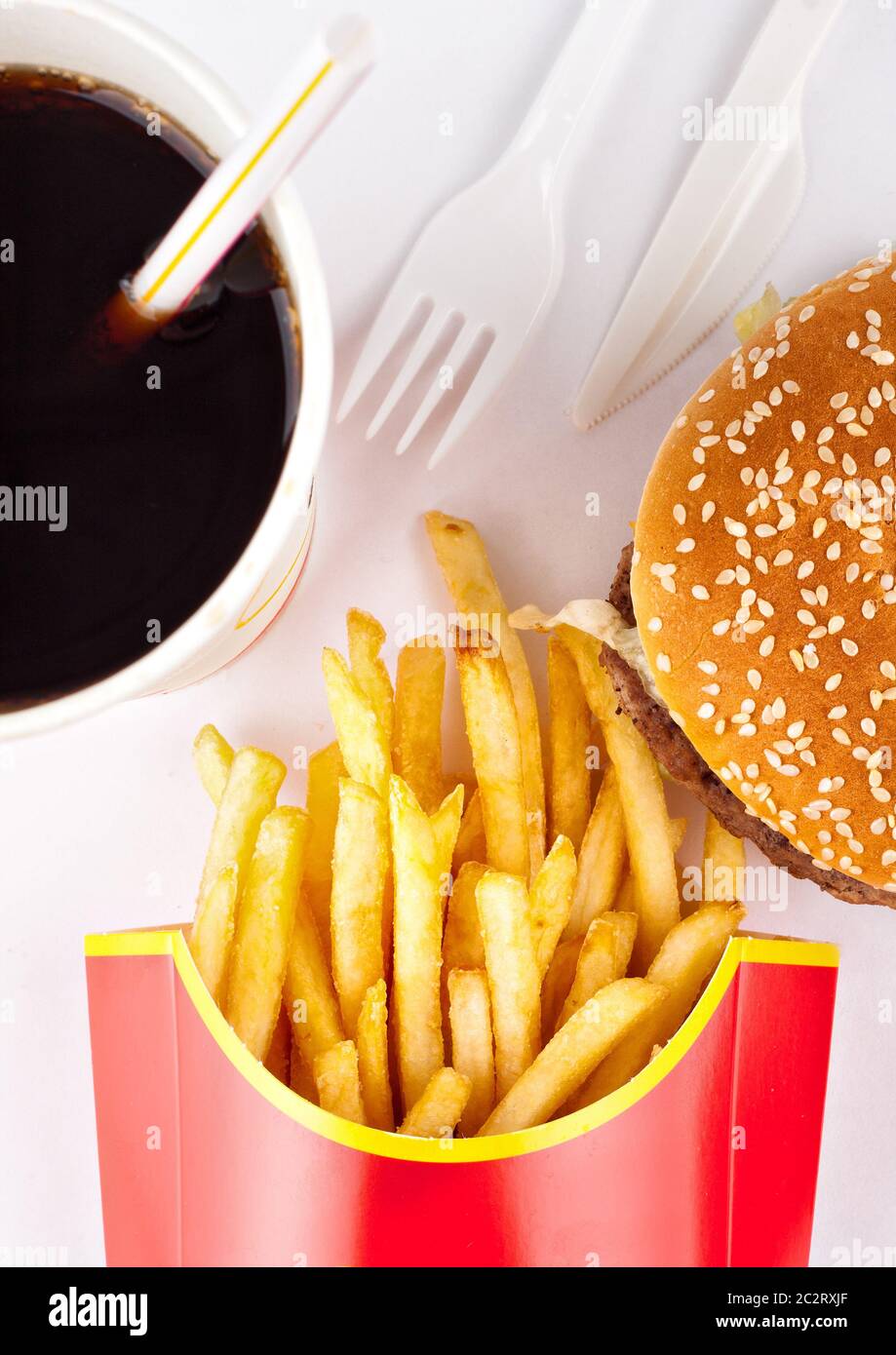 Fast food set of fried potatoes, burger and cola Stock Photo - Alamy