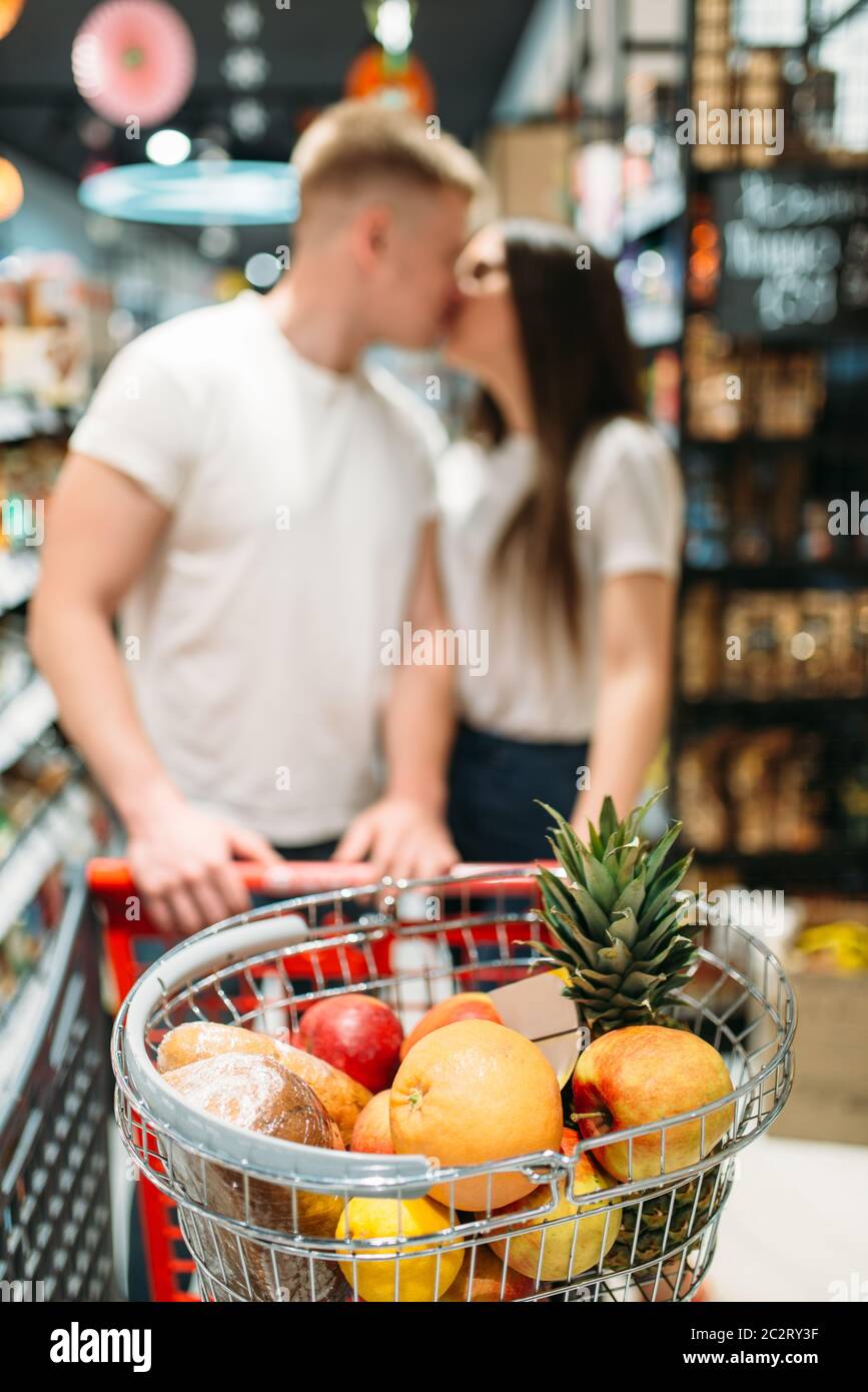 Cart With Products Young Love Couple Kissing In Supermarket On Background Playful Customers In Food Store Happy Family In Grocery Stock Photo Alamy