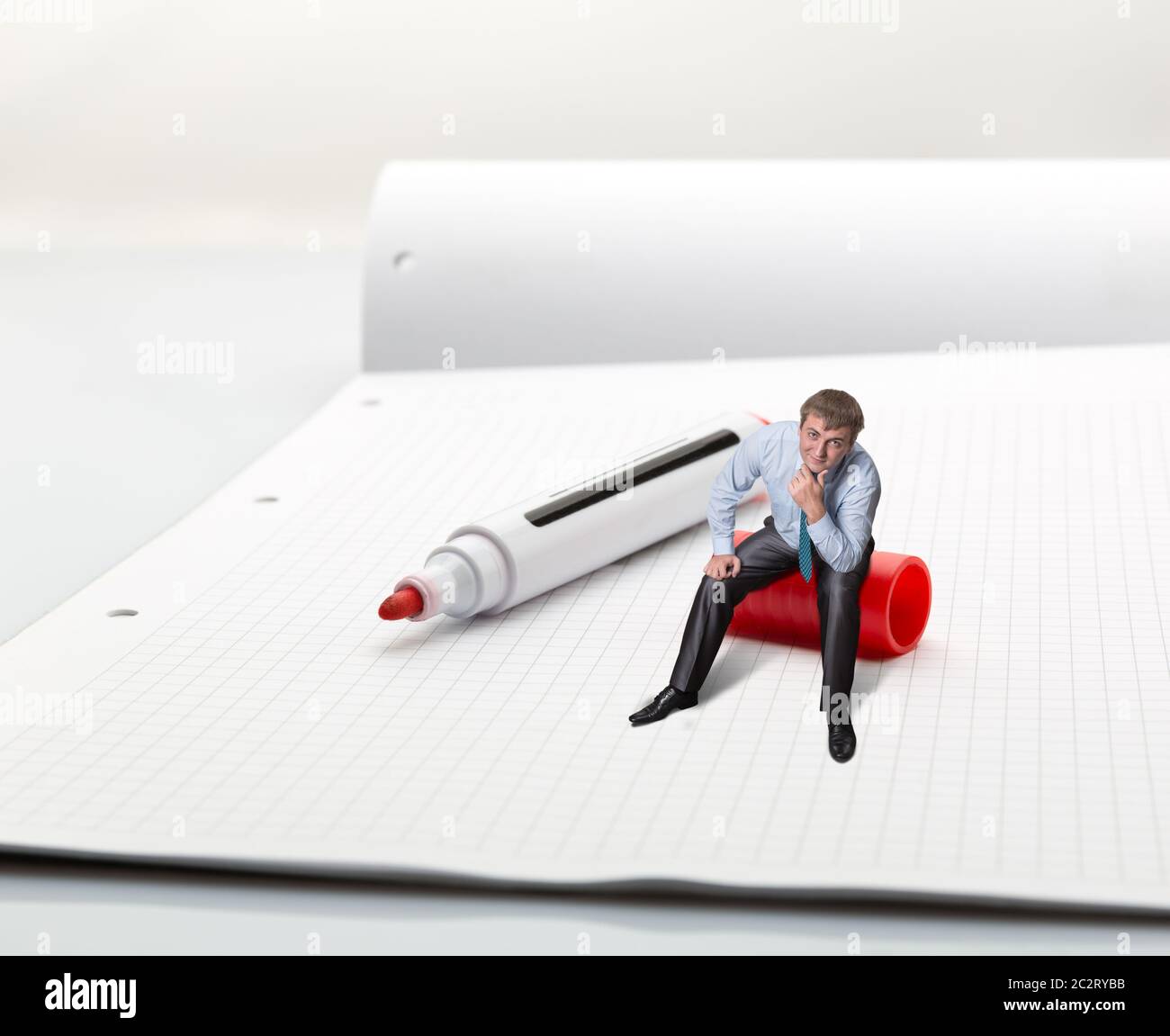 A man sitting on high-lighter thinks Stock Photo
