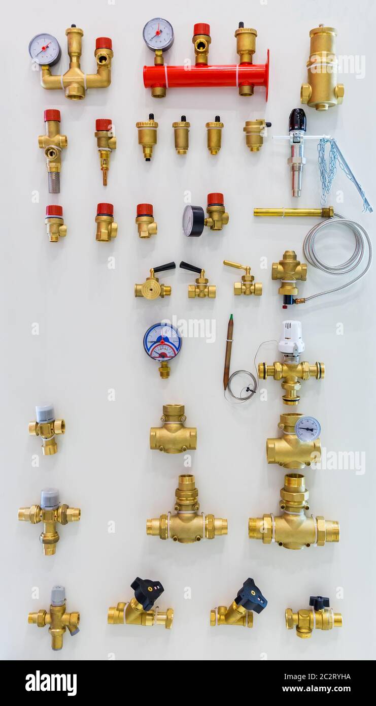 Different taps and other plumbing equipment on the wall Stock Photo Alamy