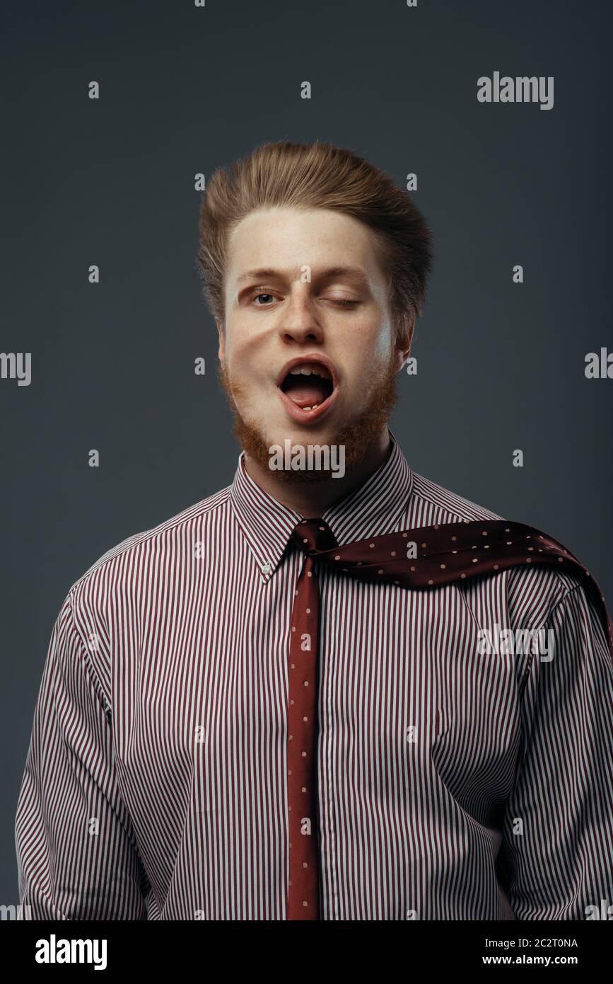 Strong wind blowing in male face, funny emotion. Powerful air flow