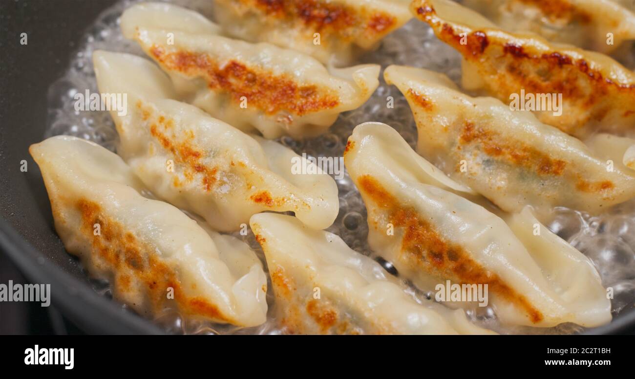 Fry Meat dumpling in pan Stock Photo Alamy