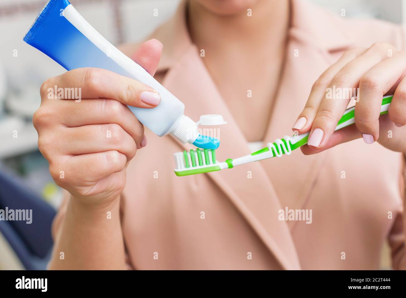 Woman putting toothpaste on the tooth brush closeup Stock Photo Alamy