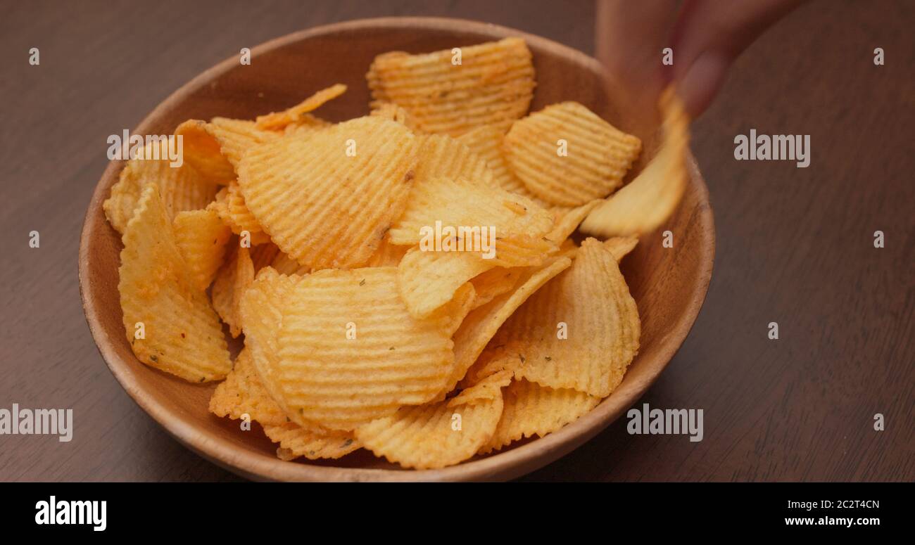 Having potato chip at party Stock Photo