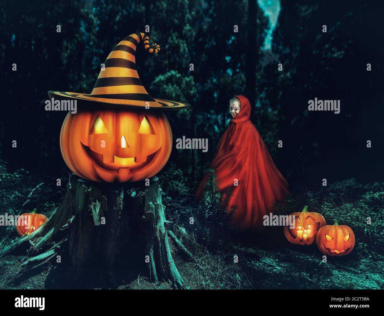 Little girl in a red gown in the forest with Helloween pumpkins Stock ...