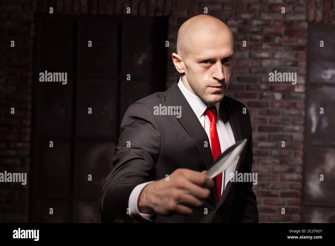 Silent killer, oriental martial arts in action. Bald contract murderer