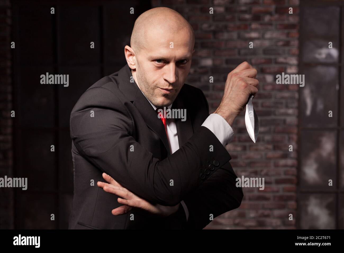 Silent killer, oriental martial arts in action. Bald contract murderer