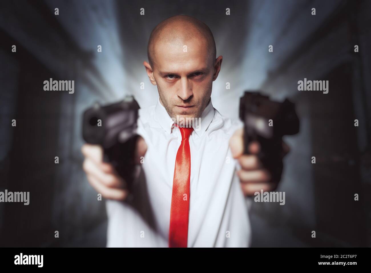 Bald killer in red tie aims with two pistols. Professional secret agent  concept. Assassin with guns, wallpaper, background or poster Stock Photo -  Alamy
