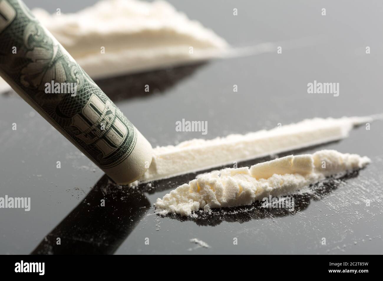 Cocaine lines and 10 dollars note on grey Stock Photo