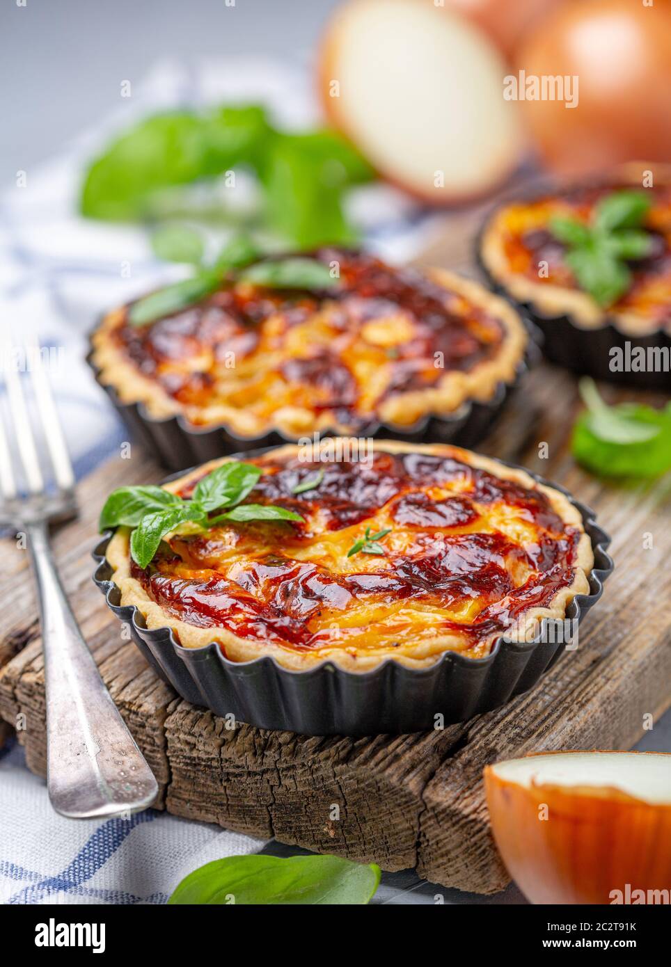 Homemade onion open mini pies. Stock Photo