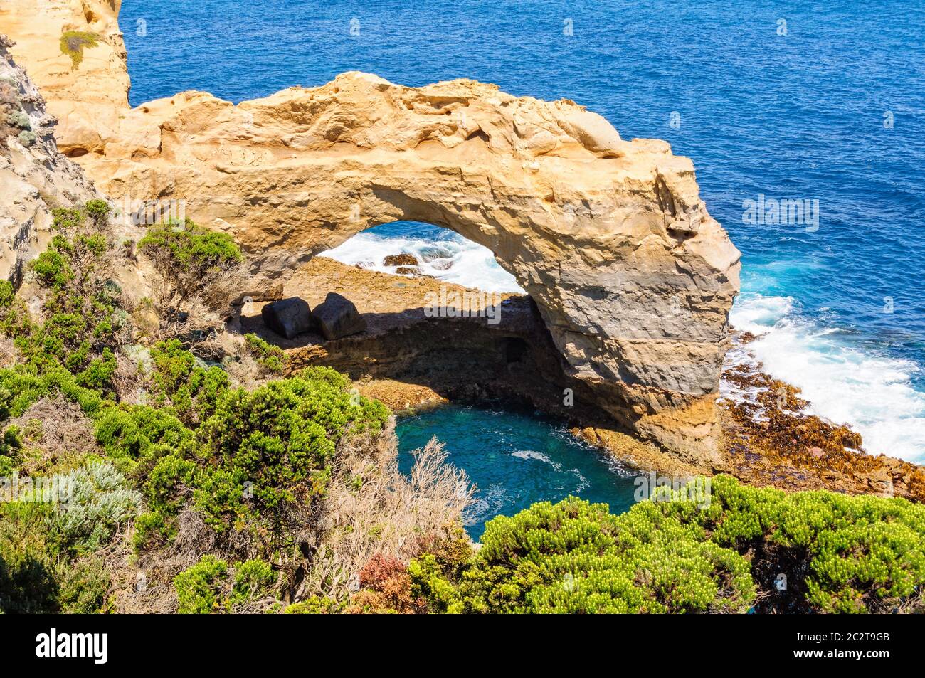 This naturally sculptured arch stands at 8 metres high - Port Campbell, Victoria, Australia Stock Photo